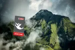 Mountain landscape with clouds and a logo in the foreground