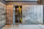 Metal lockers with doors open in a modern interior space