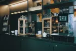 modern coffee bar with glassware and a coffee machine