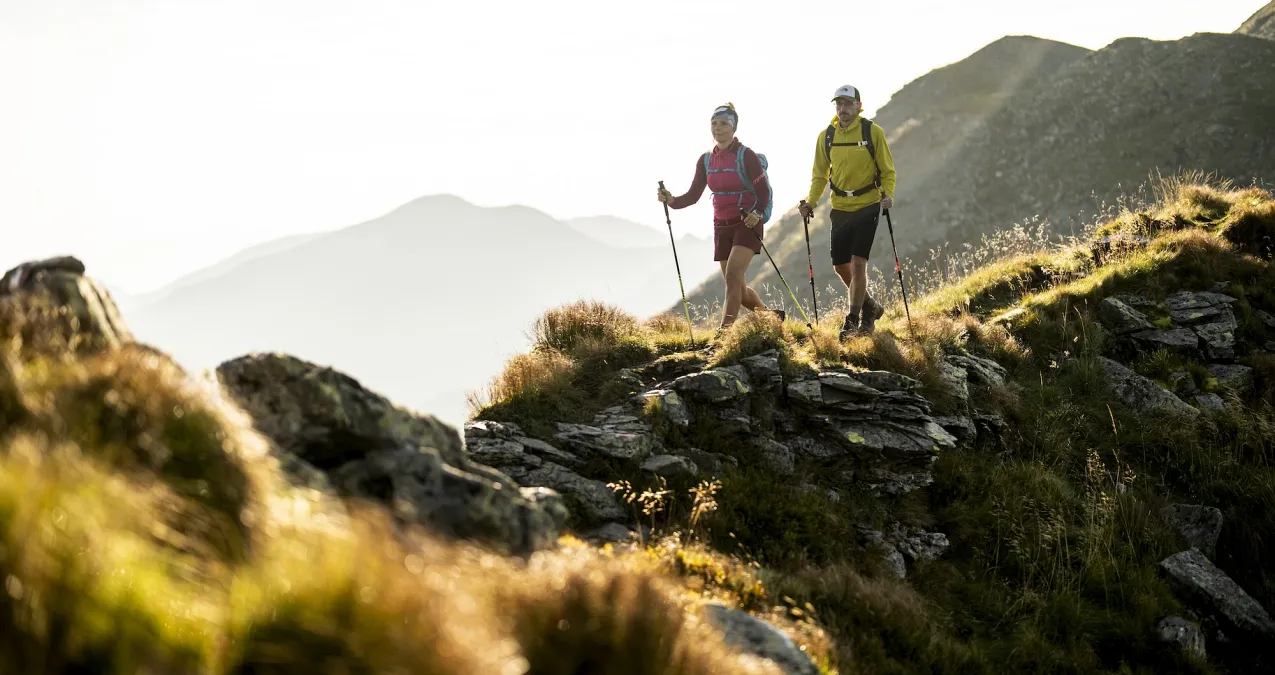 Hikers in Saalbach Hinterglemm under sunlight
